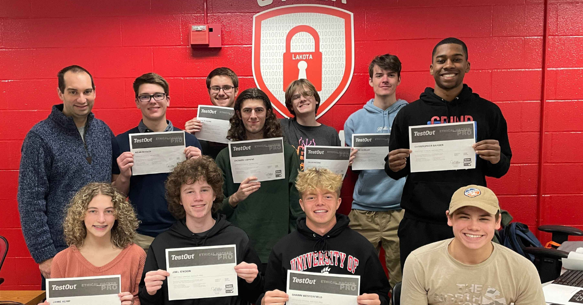 students receiving their cybersecurity certificates at an Ohio high school.